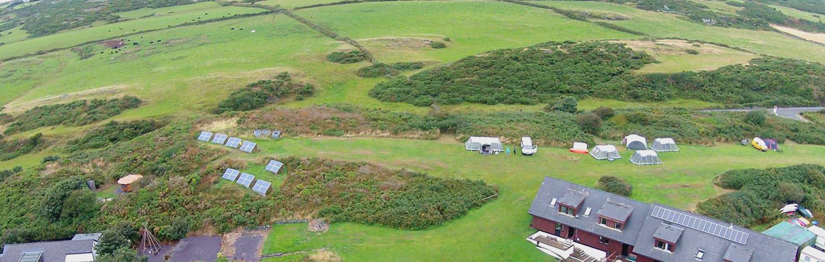 Campers  setting up atent on Anglesey Outdoor centre campsite