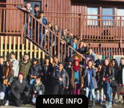 Group of people on a rock next to the outdoor activity centre